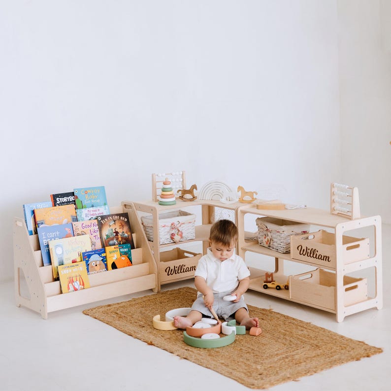 May include: A wooden playset with shelves and storage bins, featuring a child playing with toys. The shelves are labeled "William".