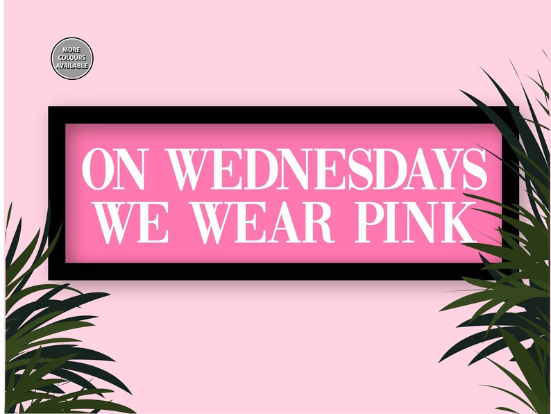 May include: A pink sign with black framing and white text that reads "On Wednesdays We Wear Pink" against a pink background with green palm leaves on either side.