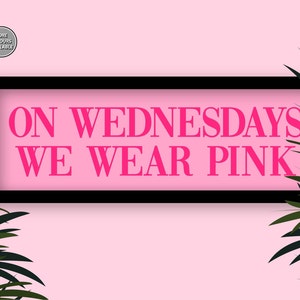 May include: A pink background with a black frame around the text "ON WEDNESDAYS WE WEAR PINK" in pink letters.