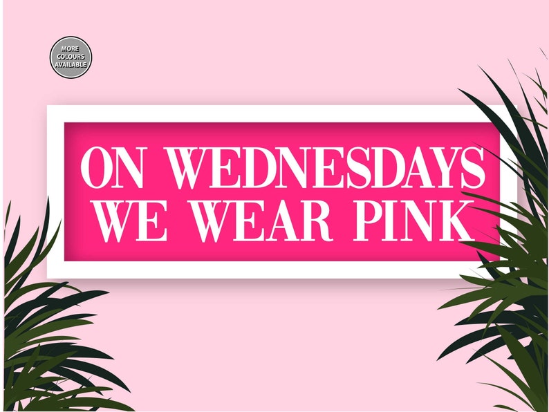 May include: A white framed sign with a pink background and the text "ON WEDNESDAYS WE WEAR PINK" in white letters.