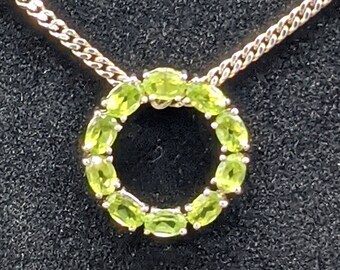 A Beautiful Garland of Ten Faceted Peridots to be Worn as a Slide Pendant, On Vintage Sterling Silver Curb Style Chain