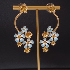 Oscar de la Renta-Gold earrings with blue enameled flowers and crystals