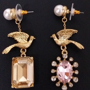 Oscar de la Renta- Golden Doves- Asymmetrical earrings encrusted with crystals.