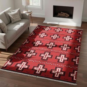 May include: A rectangular area rug featuring a vibrant red background with a repeating pattern of black and white cross symbols. The rug includes horizontal dashed lines between the rows of crosses and has white fringe along the short edges.
