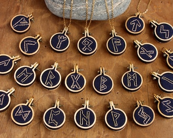 Pendants with runes hand embroidered