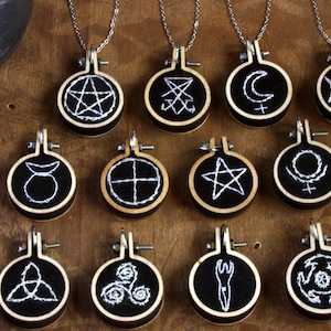 Pendants with witch symbols hand embroidered