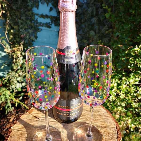 Pair of hand painted multicoloured dotty champagne glasses