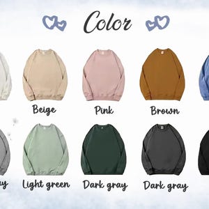 May include: Ten different color crew neck sweatshirts. The colors are white, beige, pink, brown, blue, light gray, light green, dark gray, dark gray, and black.