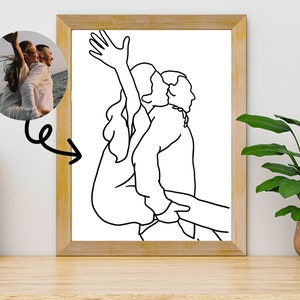 May include: A black and white line drawing of a couple embracing. The woman is holding her arm up in the air, and the man is holding her close. The drawing is on a white background.