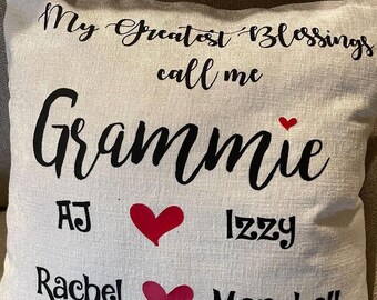 May include: A white pillow with the text "My Greatest Blessings call me Grammie" and red hearts. The names AJ, Izzy, Rachel, and Marshall are listed below the text.