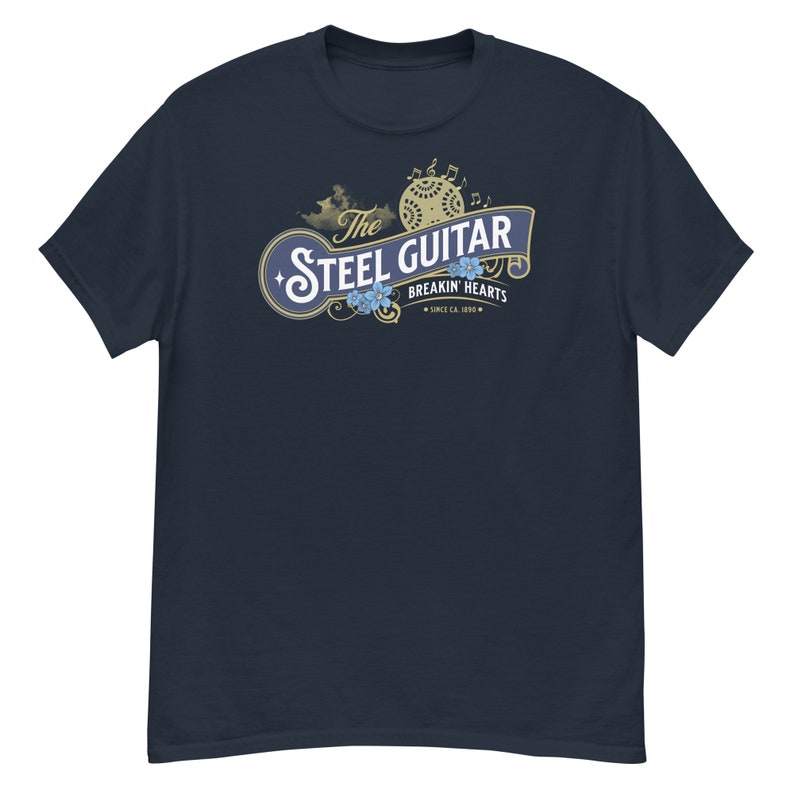 A navy-blue t-shirt on a white background. The t-shirt has a vintage design (like 1800's soap advertisement) that says "Steel Guitar, breakin' hearts since 1890s"