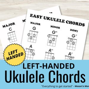 May include: White printed sheets displaying ukulele chord diagrams for left-handed players. The sheets show major, minor, and dominant 7th chords, with the text "Easy Ukulele Chords" at the top. A yellow sticker reads "Left Handed".
