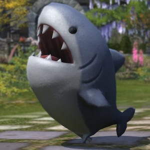 May include: A cartoon shark with a gray body and white belly, fins, and teeth. The shark has a wide open mouth, revealing sharp teeth. The shark is standing on a grassy surface.