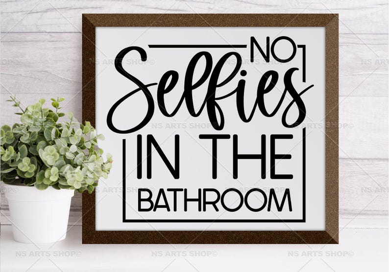 May include: A white framed sign with black text that reads "No. 1 Selfies in the Bathroom".