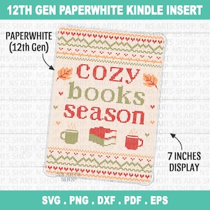 May include: A rectangular Kindle insert for a 12th Gen Paperwhite with a 7-inch display. The design features a cross-stitch pattern with the text "cozy books season" in red and green, surrounded by autumn leaves, a book, and two mugs.
