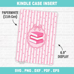 May include: A rectangular Kindle case insert for Paperwhite 11th Gen with a 6.9 inch display. The design features vertical pink and white stripes with small hearts, and a central emblem showing a stack of three books topped with a pink bow.