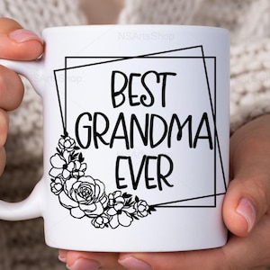 May include: White ceramic mug with a black floral design and the text "Best Grandma Ever" inside a black geometric frame.