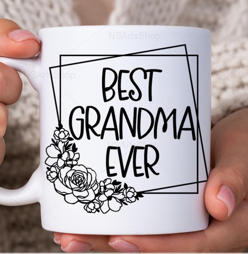 May include: White ceramic mug with a black floral design and the text "Best Grandma Ever" inside a black geometric frame.