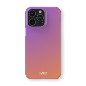 May include: A gradient phone case in shades of purple, pink, and orange. The case has a smooth finish and a cutout for the camera lenses. The word "CLASSY" is printed in white at the bottom of the case.