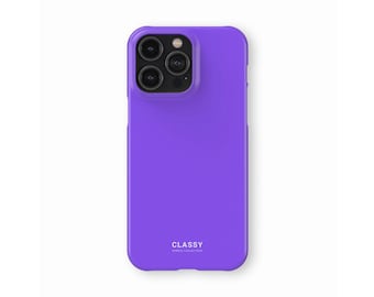 May include: A purple phone case with a camera lens cutout and the word "CLASSY" printed on the back.