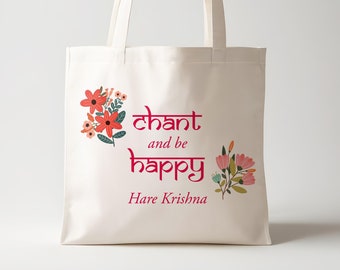 May include: White canvas tote bag with pink and red floral designs and the text "chant and be happy Hare Krishna" in pink.