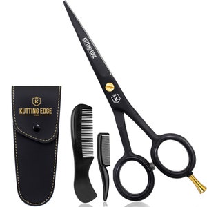 May include: Black hair cutting shears with gold accents and a black leather case. The shears are accompanied by two black combs.