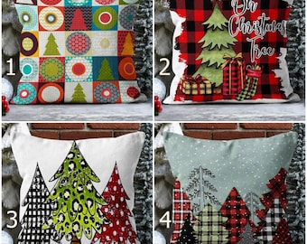 May include: Four decorative throw pillows with Christmas-themed designs. One pillow features a patchwork pattern, another has a Christmas tree with gifts, and two others display stylized Christmas trees in various patterns and colors.