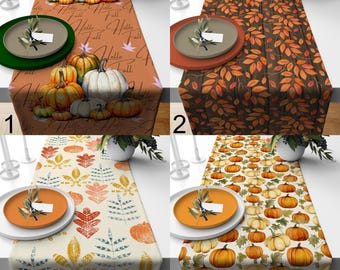 May include: Four fall-themed table runners with different designs. One features pumpkins and the text "Hello Fall", another has orange leaves, a third has leaf and pumpkin patterns, and the last one is covered in pumpkins.