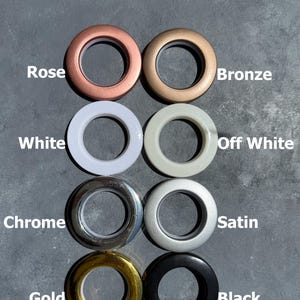 a collection of eight different colored ring shades, each labeled with its corresponding color name.