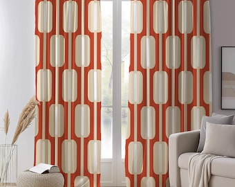 May include: Pair of retro-style window curtains. The curtains feature a repeating pattern of cream-coloured, vertical rectangles and lines against a red-orange background. The curtains are hanging in front of a window, with a neutral-toned sofa and decor in the background.