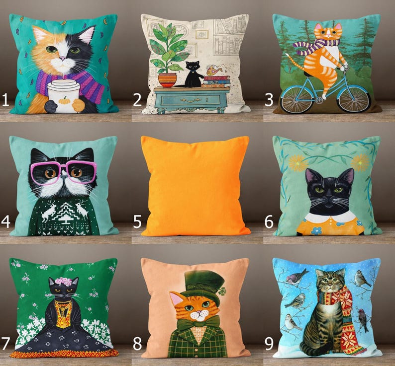 This image shows a 3x3 grid of 9 decorative pillow covers, each featuring a unique cat illustration. The designs include cats holding mugs, riding bikes, wearing glasses or sweaters, surrounded by birds, or dressed in costumes. Some pillows are autumn or winter-themed, while one is a solid bright orange. All covers are colorful, whimsical, and full of personality—perfect for home decor or as a gift for cat lovers.