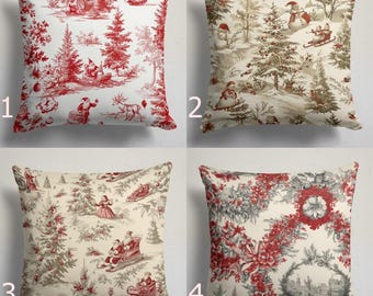 May include: Set of four square decorative throw pillows with Christmas-themed designs. Pillows feature red and white, and beige and brown toile patterns with Santa, snowmen, and winter scenes. Perfect for holiday decor.
