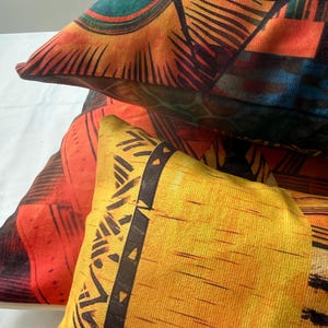 a close-up view of a collection of colorful, patterned pillows.