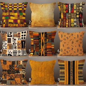 May include: Nine decorative throw pillows with various African-inspired patterns. Pillows feature geometric designs, tribal motifs, and abstract art in colors like yellow, orange, brown, and black. The pillows are square-shaped and made of a soft fabric.