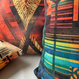 a close-up view of a vibrant, colorful pillow with a geometric pattern.