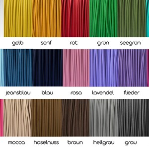 May include: A color palette of cords in various shades, including white, yellow, red, green, and blue. The image displays a range of colors with German text labels underneath each color, such as "wei&szlig;" and "gelb".