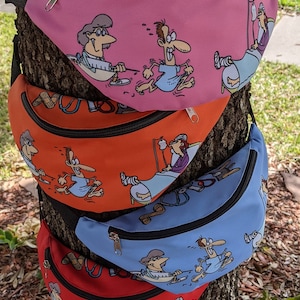 May include: Four colorful fanny packs with cartoon illustrations of people in hospital beds and doctors. The fanny packs are stacked on top of each other, with the pink one on top and the red one on the bottom.