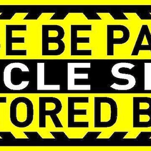 May include: Yellow and black warning sign with black text that reads "PLEASE BE PATIENT VEHICLE SPEED MONITORED BY GPS".