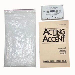 May include: A white cassette tape labeled Acting With An Accent American Southern, a beige instructional booklet titled Acting With An Accent A Step-By-Step Approach to Learning Dialects by David Alan Stern, Ph.D., and a clear plastic storage bag.