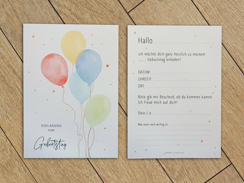 May include: A birthday invitation card with a watercolor illustration of colorful balloons. The card has the text "Einladung zum Geburtstag" which translates to "Invitation to Birthday" in English.