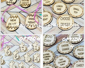 May include: Four sets of wooden tokens with different options for a family game night. Each set has a different theme, including ice cream, movie night, zoo day, and pizza night. The tokens are decorated with various designs and text.