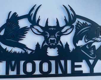 May include: Black metal silhouette of a deer, a pheasant, and a bass fish with a forest background and the name "MOONEY" below.
