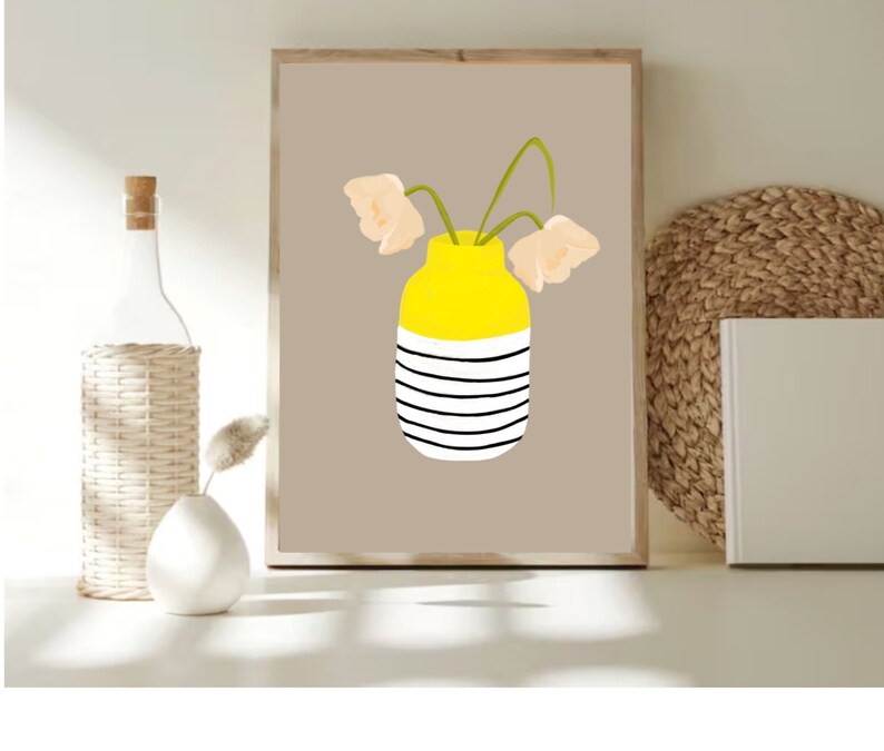 May include: A printable art print featuring a yellow and white striped vase with three light peach flowers. The vase is on a light brown background.