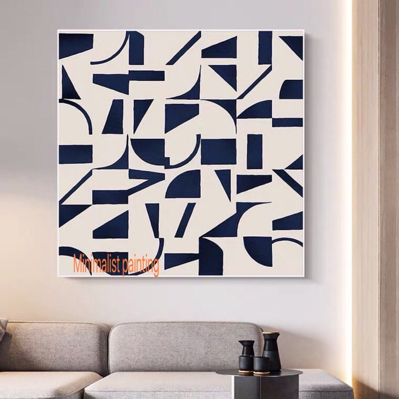May include: Abstract geometric painting with a white background and navy blue shapes. The painting features a variety of geometric shapes, including squares, rectangles, triangles, and circles. The shapes are arranged in a random pattern, creating a visually interesting and dynamic composition. "Minimalist painting" is written in the bottom left corner of the painting.