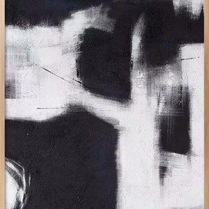 May include: Abstract painting with black and white brushstrokes. The painting features a large white shape in the center, with smaller black shapes surrounding it.
