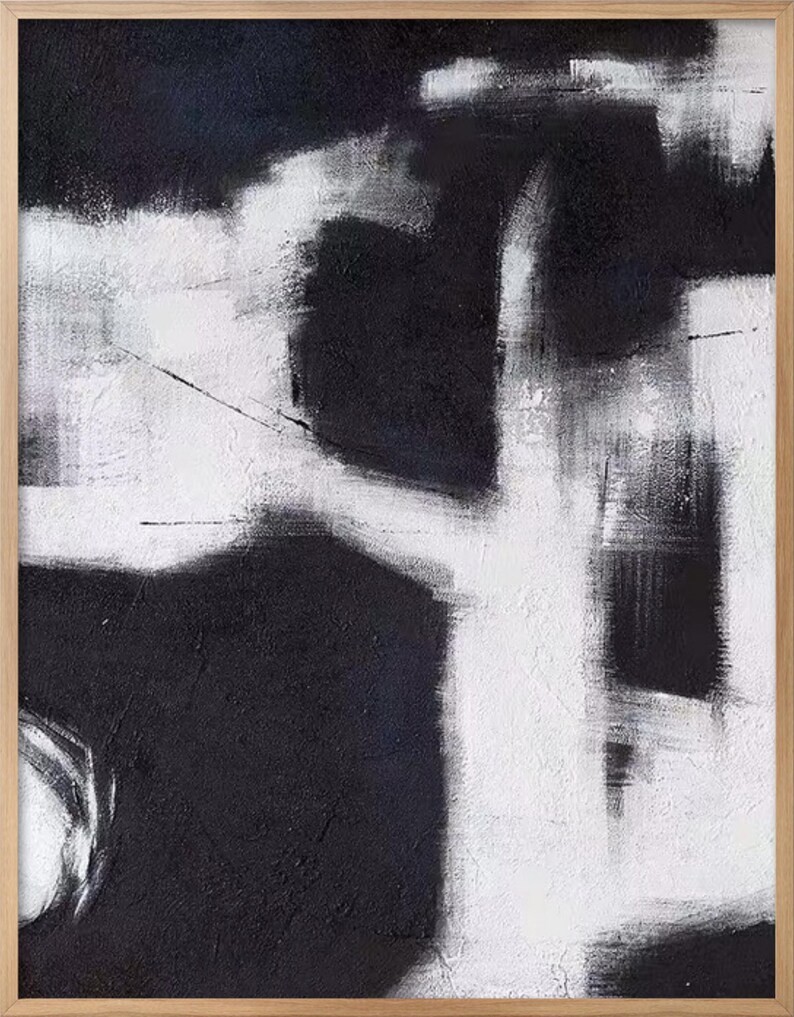 May include: Abstract painting with black and white brushstrokes. The painting features a large white shape in the center, with smaller black shapes surrounding it.