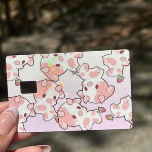 Diseño de tarjeta de débito/crédito con diseño de vaca fresa brillante