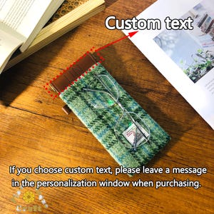 May include: Green plaid eyeglasses case with a brown leather top and the text "LIN". The case holds a pair of eyeglasses. The text "Custom text" is visible. The text "If you choose custom text, please leave a message in the personalization window when purchasing" is also visible.