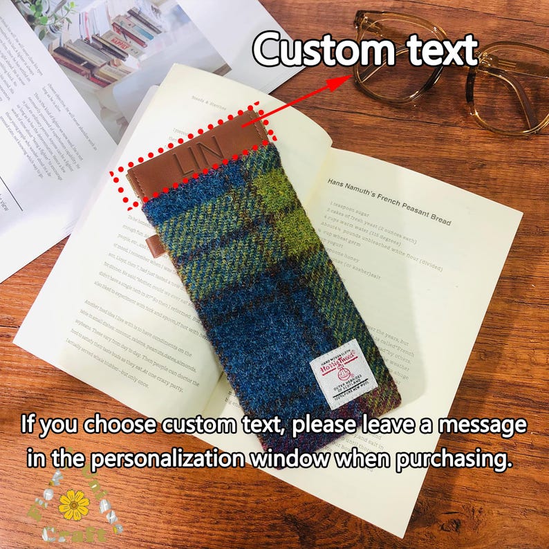 May include: A blue and green plaid glasses case with a brown leather flap. The flap has the word "LIN" embossed on it. The case is lying on a book with the text "Hans Namuth's French Peasant Bread". The text "Custom text" is written above the case with an arrow pointing to it. The text "If you choose custom text, please leave a message in the personalisation window when purchasing." is written below the case.