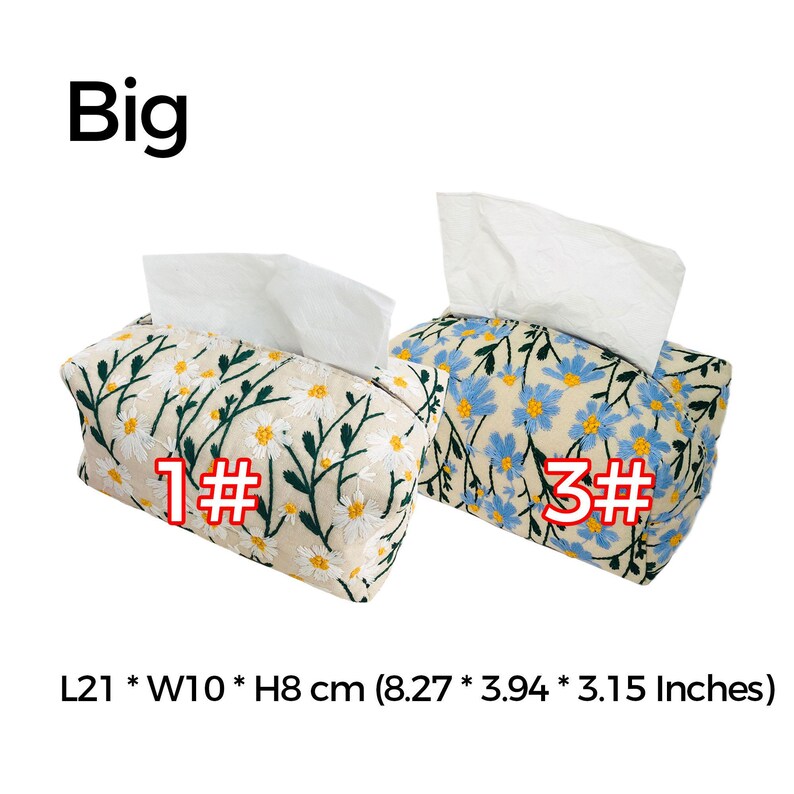 May include: Two tissue box covers with floral embroidery. The cover on the left has white flowers on a beige background. The cover on the right has blue flowers on a beige background. Both covers are labeled with numbers, "1#" and "3#" respectively. The covers measure 8.27 inches long, 3.94 inches wide, and 3.15 inches high.